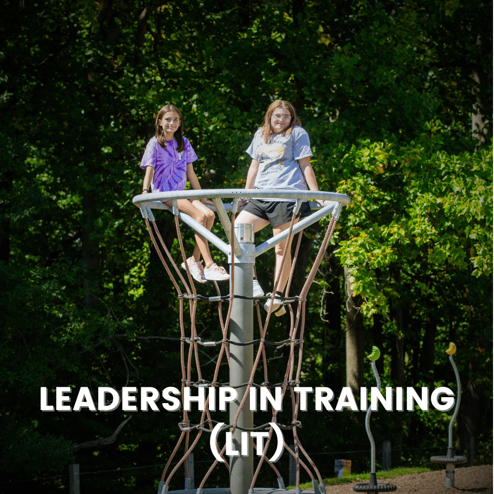 Two children climb a tower on the playground
